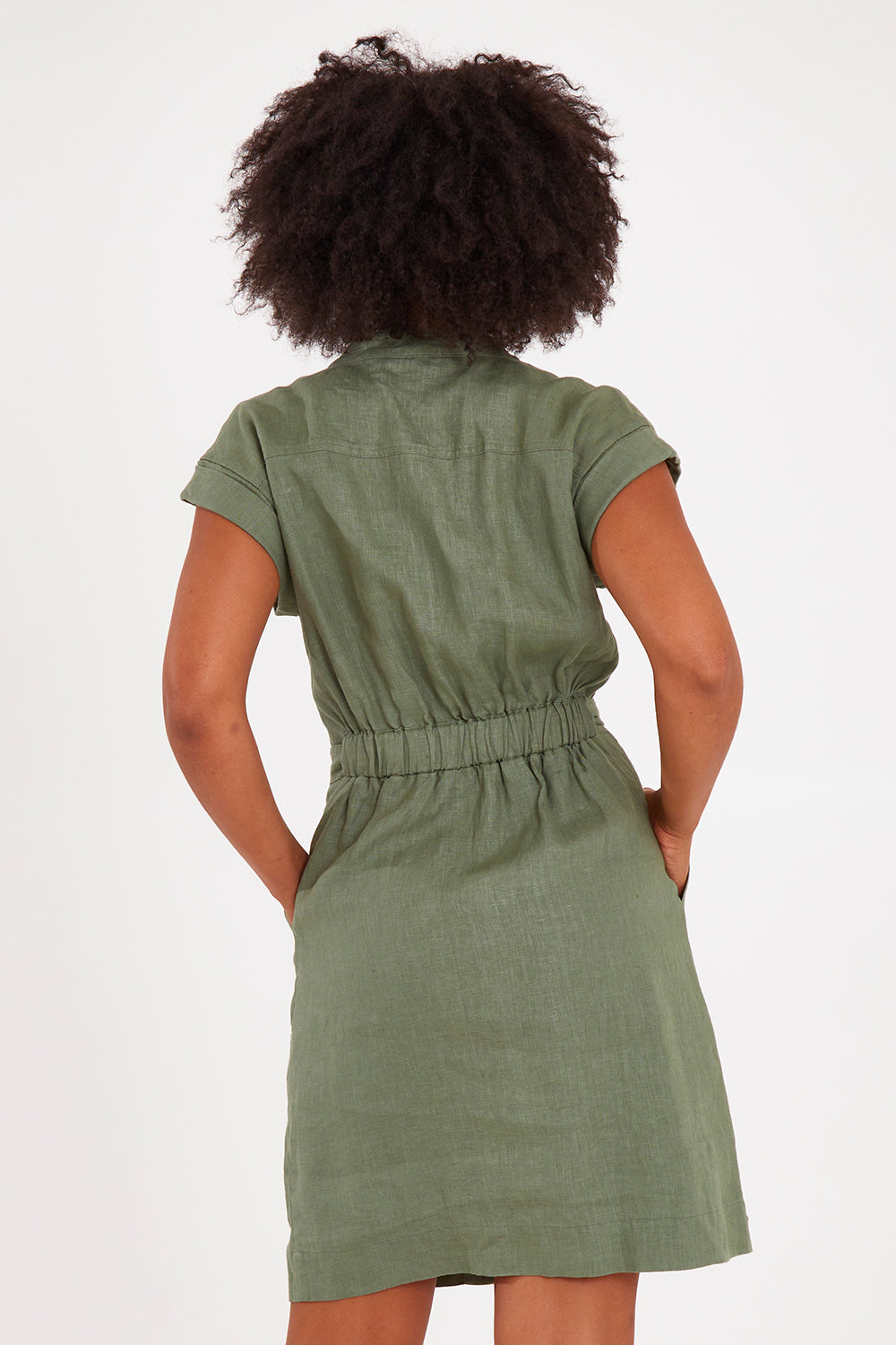 Model Olivia wearing size 10 of the Harlow Dress in colour Khaki (Green), from the back