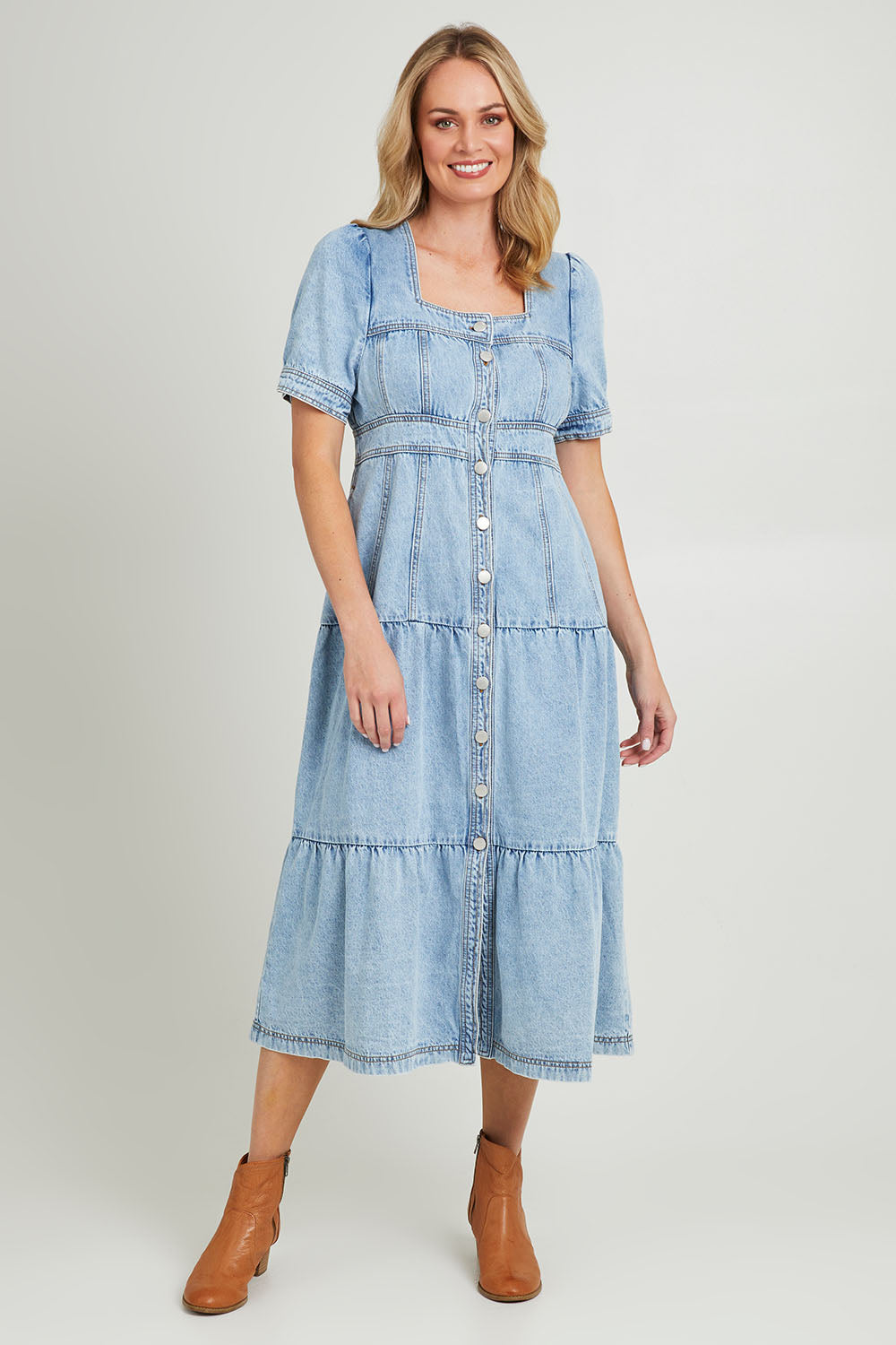 Model Grace wearing size 10 of the Astrid Denim Dress in colour Lightblue (Green), from the front, showing the whole outfit