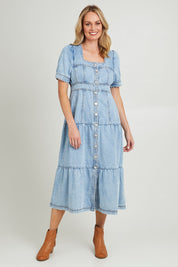 Model Grace wearing size 10 of the Astrid Denim Dress in colour Lightblue (Green), from the front, showing the whole outfit
