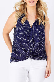Model Jess wearing size 12 of the Martinike Sleeveless Top in colour NavyPolka (Blue), from the front, cropped image