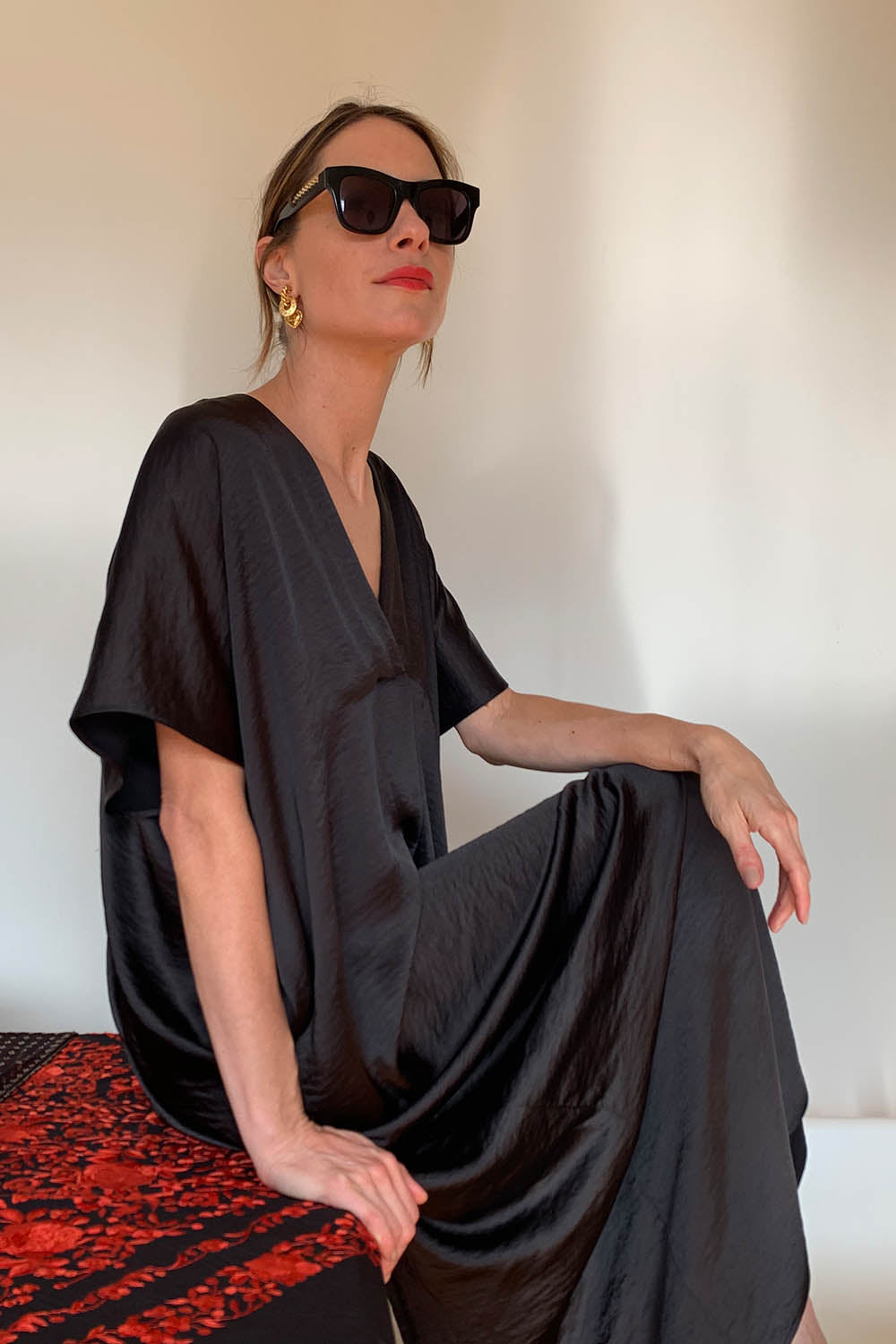 A model wearing the Before Midnight Dress in colour Black (Black), from the front, showing the whole outfit