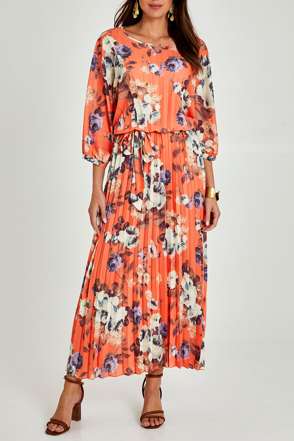 Model Madeline wearing size 10 of the Jolene Pleated Maxi Dress in colour Tangerine, from the front, cropped image