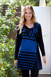 A model wearing the Striped Drape Cardigan in colour Cobalt (Blue), from the front, showing the whole outfit