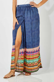 Model Anna wearing size S of the Durban Palazzo Pant in colour Durban (Blue), from the front, cropped image