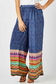 Model Anna wearing size S of the Durban Palazzo Pant in colour Durban (Blue), from the front, cropped image