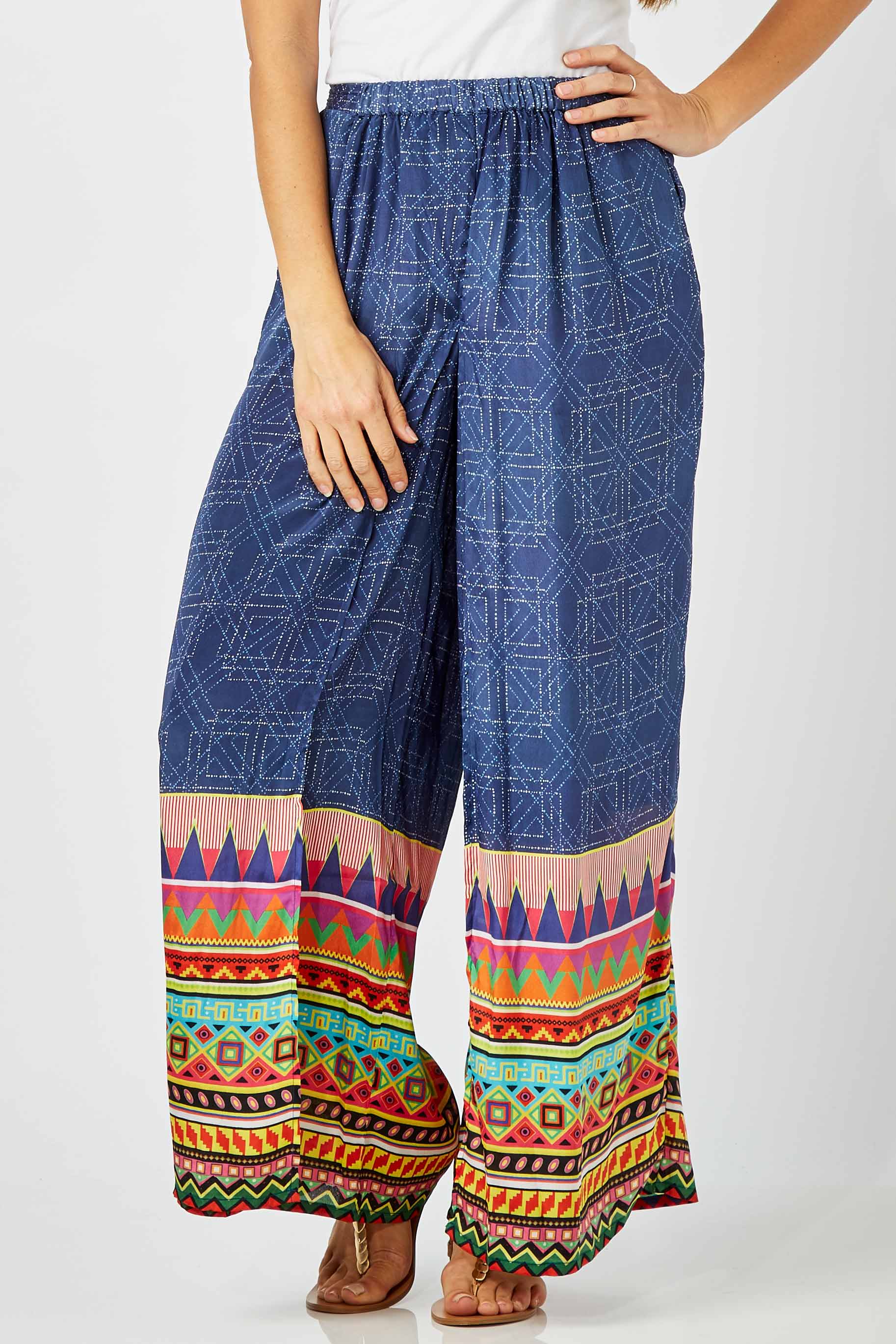Model Anna wearing size S of the Durban Palazzo Pant in colour Durban (Blue), from the front, cropped image