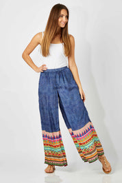 Model Anna wearing size S of the Durban Palazzo Pant in colour Durban (Blue), from the front, showing the whole outfit