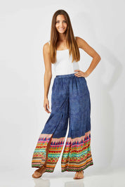 Model Anna wearing size S of the Durban Palazzo Pant in colour Durban (Blue), from the front, showing the whole outfit