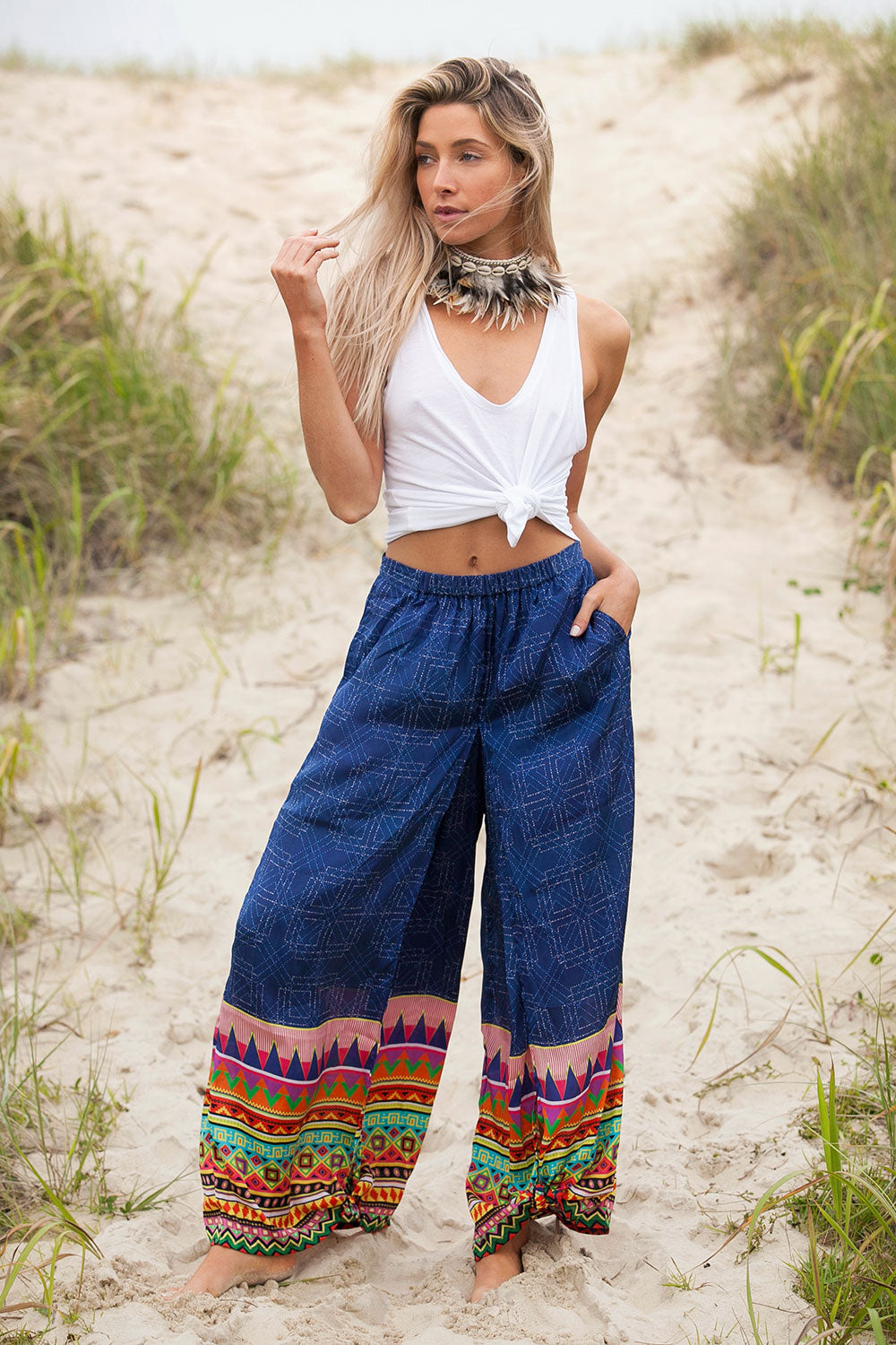 A model wearing the Durban Palazzo Pant in colour Durban (Blue), from the front, showing the whole outfit