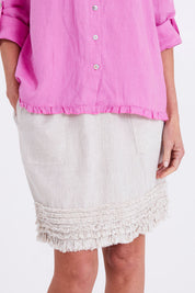 Model Emma wearing size 10 of the Frill Hem Pull On Linen Skirt in colour Natural, from the front, cropped image