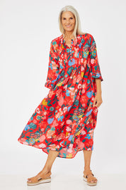 Model Rachel wearing the Floral Tuck Front Dress in colour Red (Red), from the front, showing the whole outfit