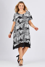 Model Ljubenka wearing size 18 of the Patterned Dress in colour BlackWhite (Black), from the front, showing the whole outfit