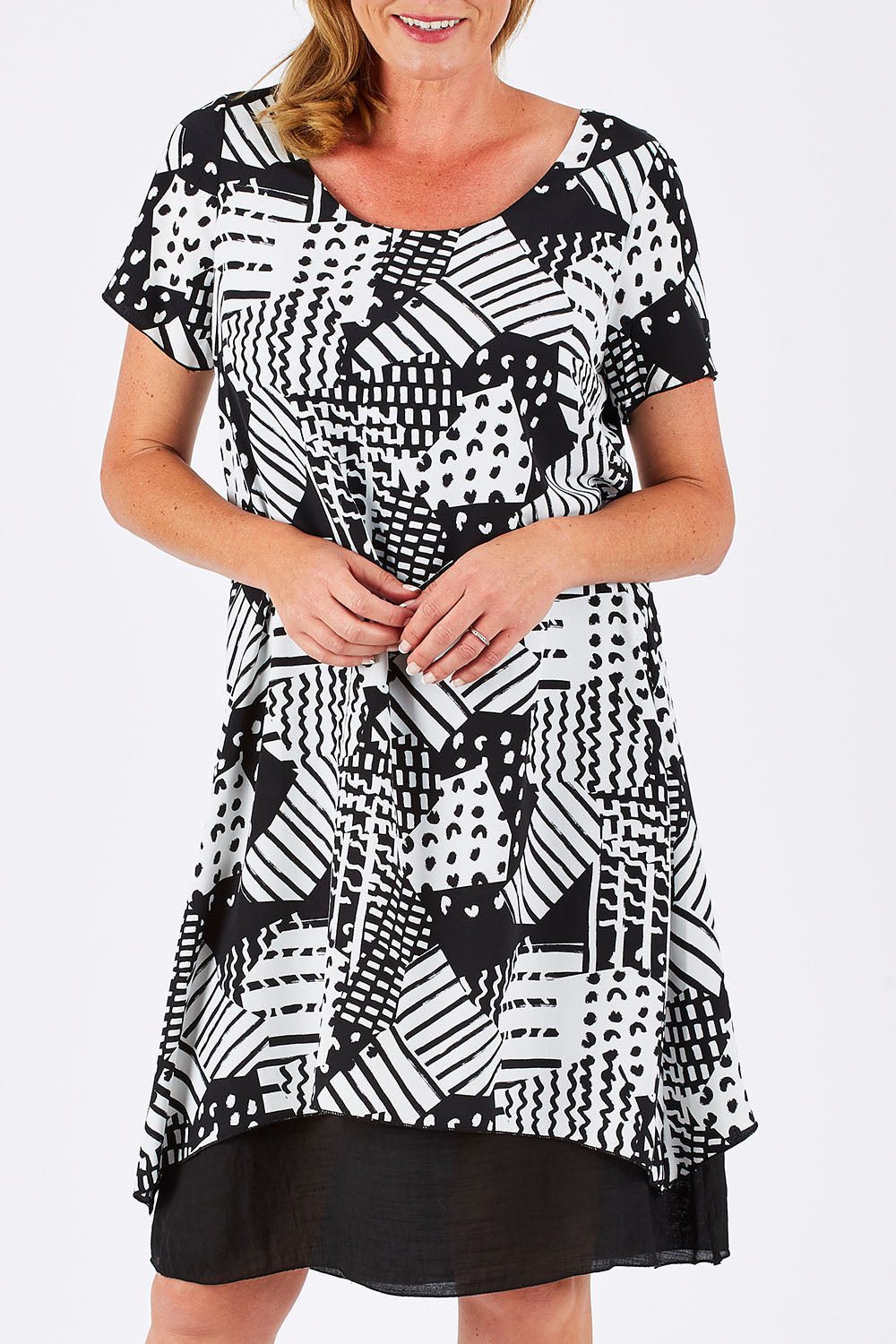 Model Louise wearing size 10 of the Patterned Dress in colour BlackWhite (Black), from the front, cropped image
