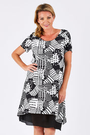Model Louise wearing size 10 of the Patterned Dress in colour BlackWhite (Black), from the front, cropped image