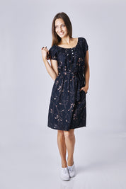 Model Anna wearing size 10 of the Cap Sleeve Dress in colour Navy (Blue), from the front, showing the whole outfit