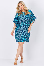 Model Jess wearing size 14 of the Bell Sleeve Tunic Dress in colour TearDrop (Blue), from the front, showing the whole outfit