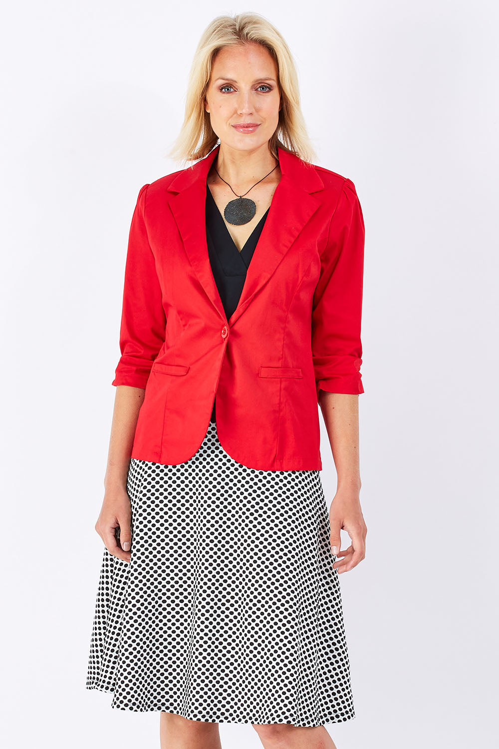 Model Jude wearing size 10 of the Spotted A Line Skirt in colour Spotted (White), from the front, cropped image