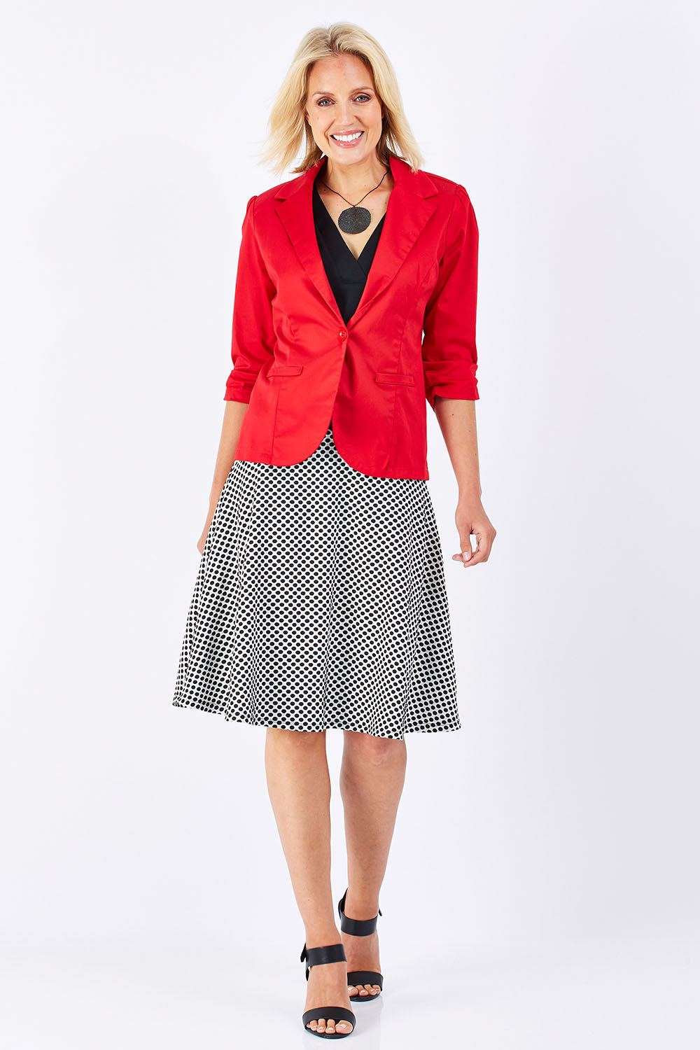 Model Jude wearing size 10 of the Spotted A Line Skirt in colour Spotted (White), from the front, showing the whole outfit