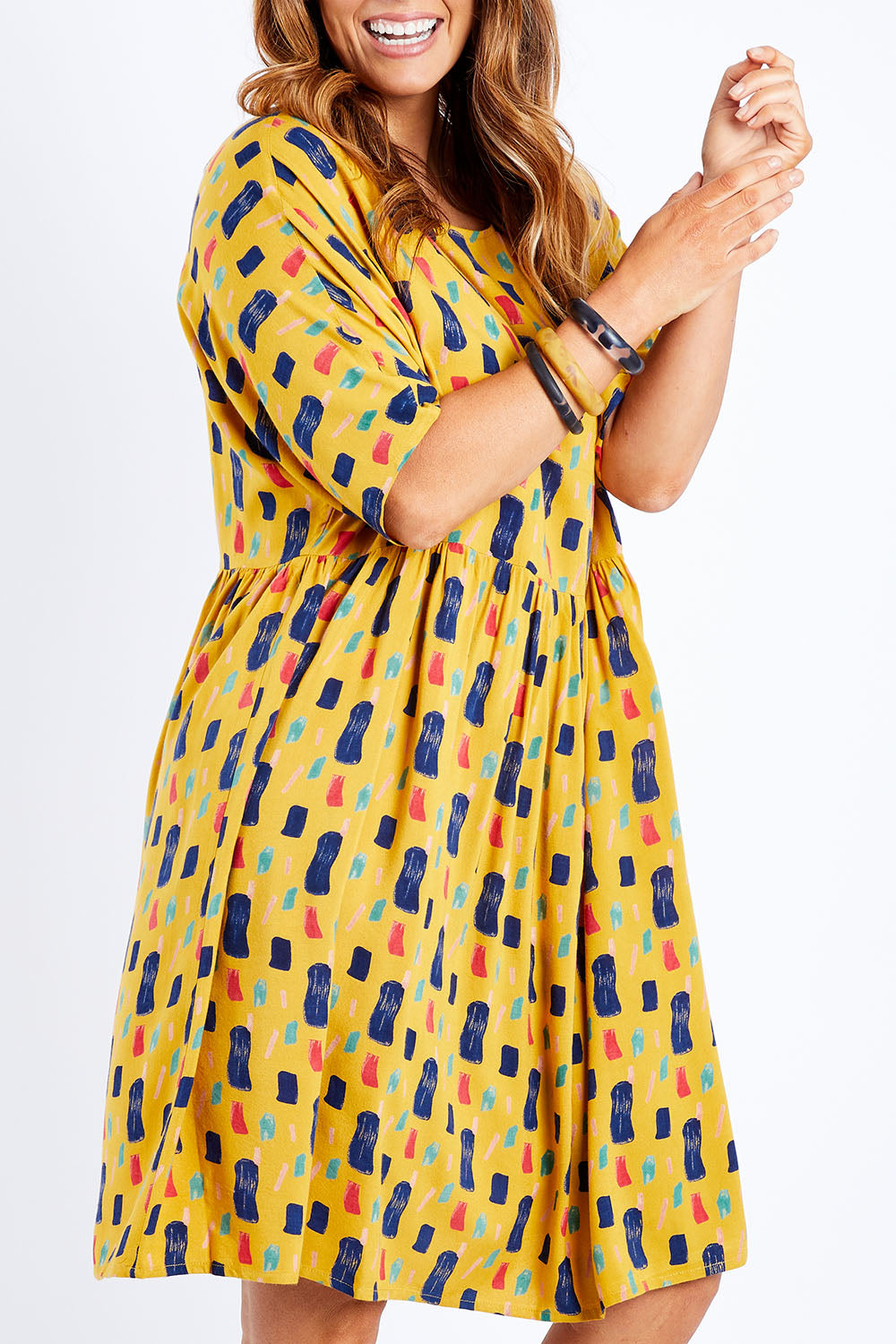 Model Laura wearing size 14 of the High Waist Relaxed Dress in colour Painting, from the front, cropped image