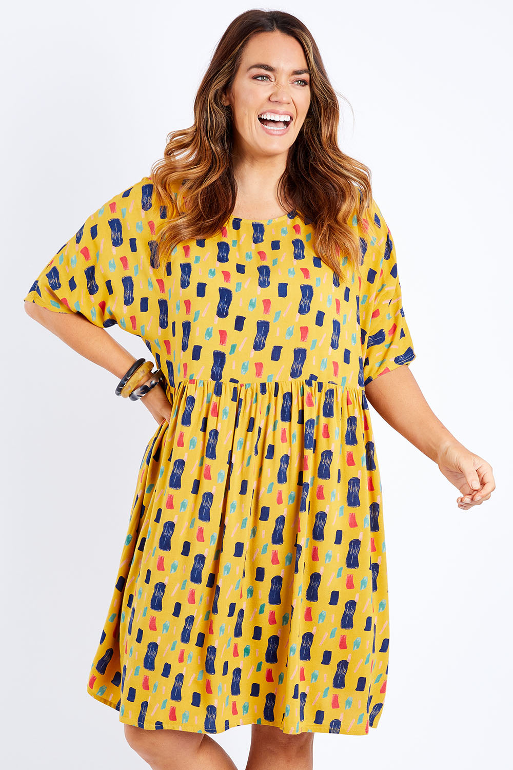 Model Laura wearing size 14 of the High Waist Relaxed Dress in colour Painting, from the front, cropped image