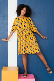 Model Schanez wearing size 10 of the High Waist Relaxed Dress in colour Painting, from the front, showing the whole outfit