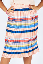 Model Shanaya wearing size 14 of the Pleated Stripe Skirt in colour Pleated (Pink), from the front, cropped image