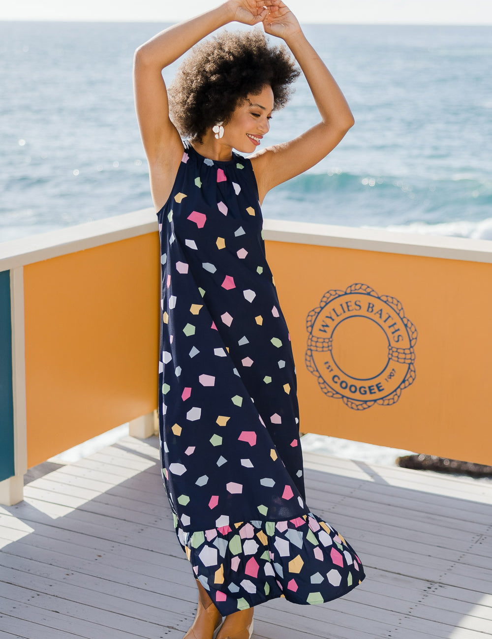 Model Olivia wearing size 10 of the Falling Bricks Maxi in colour Jigsaw (Blue), from the front, showing the whole outfit