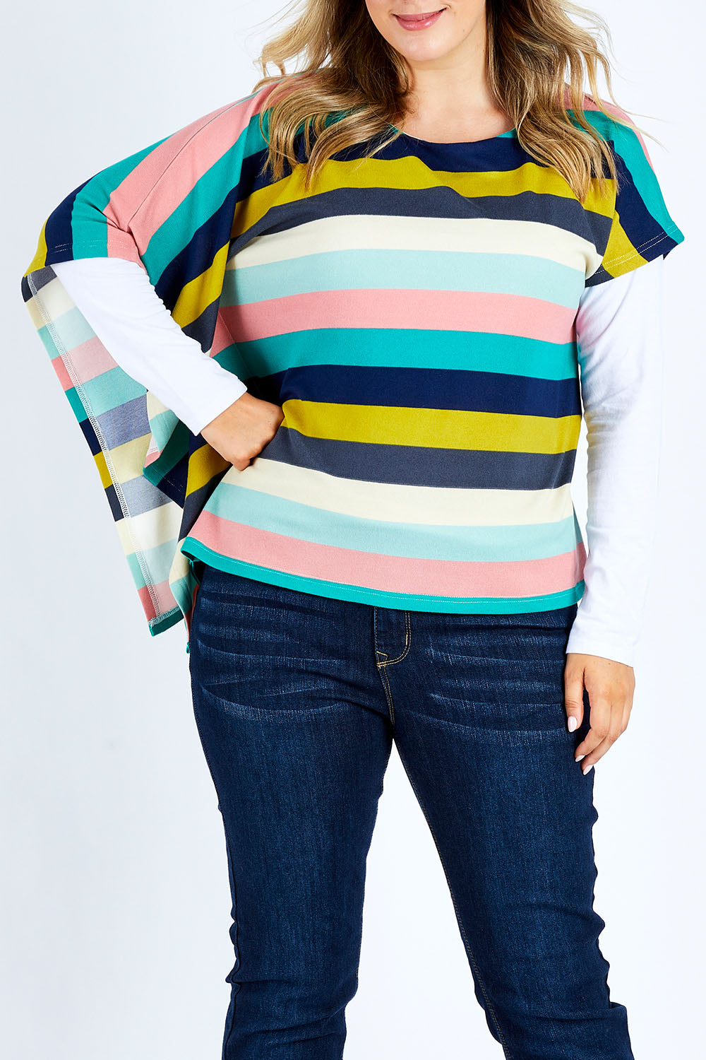 Model Jess wearing size 14 of the Oversized Printed Tunic in colour Rainbow (Blue), from the front, showing the whole outfit