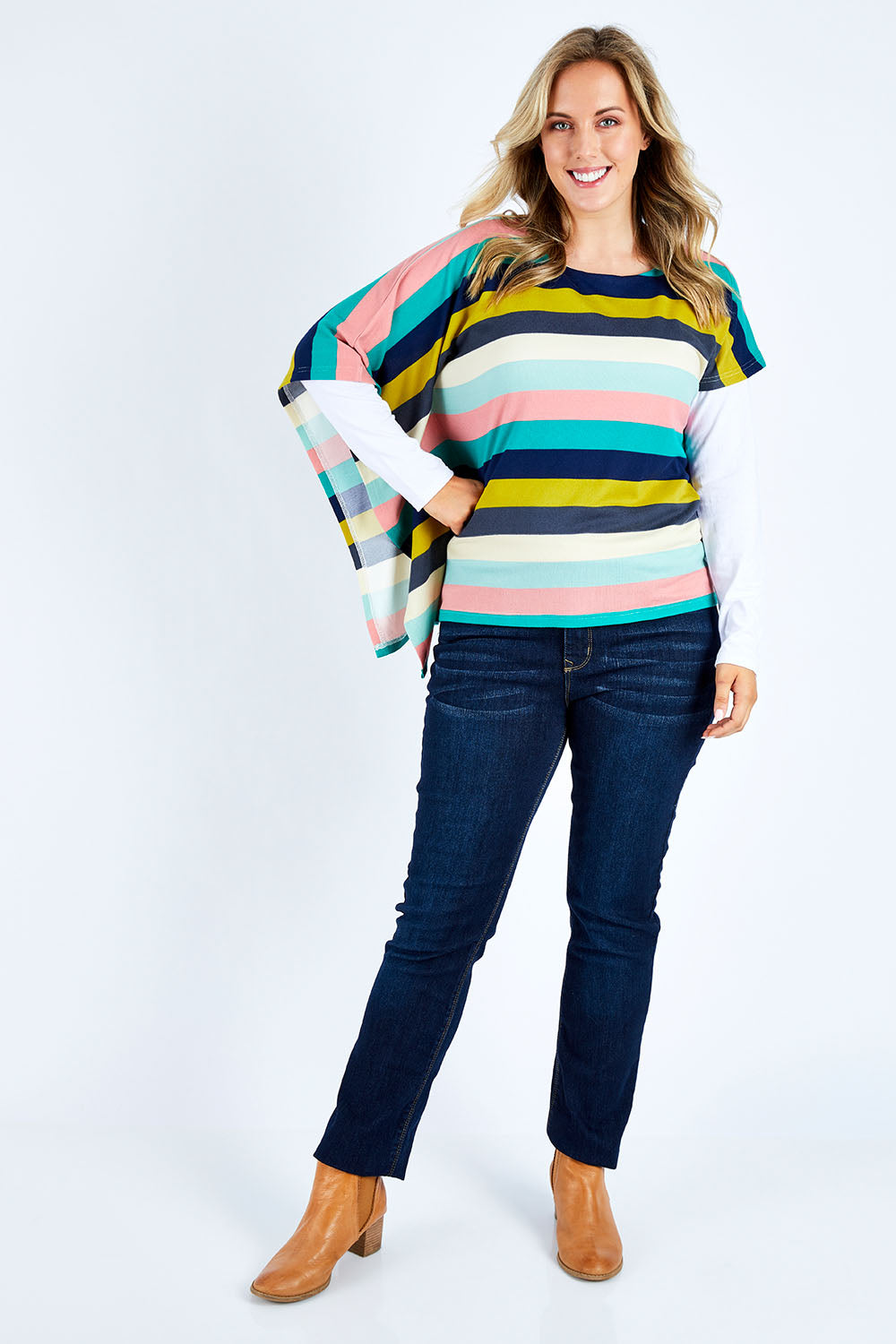 Model Jess wearing size 14 of the Oversized Printed Tunic in colour Rainbow (Blue), from the front, showing the whole outfit