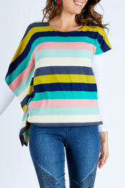 Model Madeline wearing size 10 of the Oversized Printed Tunic in colour Rainbow (Blue), from the front, cropped image