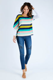 Model Madeline wearing size 10 of the Oversized Printed Tunic in colour Rainbow (Blue), from the front, showing the whole outfit