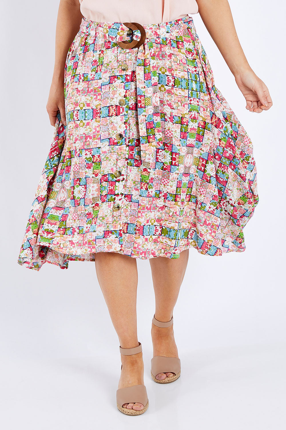 Model Laura wearing size 14 of the Belted Button Skirt in colour Patchmeup (Pink), from the front, cropped image