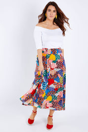 Model Laura wearing size 14 of the Patchwork Maxi Skirt in colour Patched (Red), from the front, showing the whole outfit
