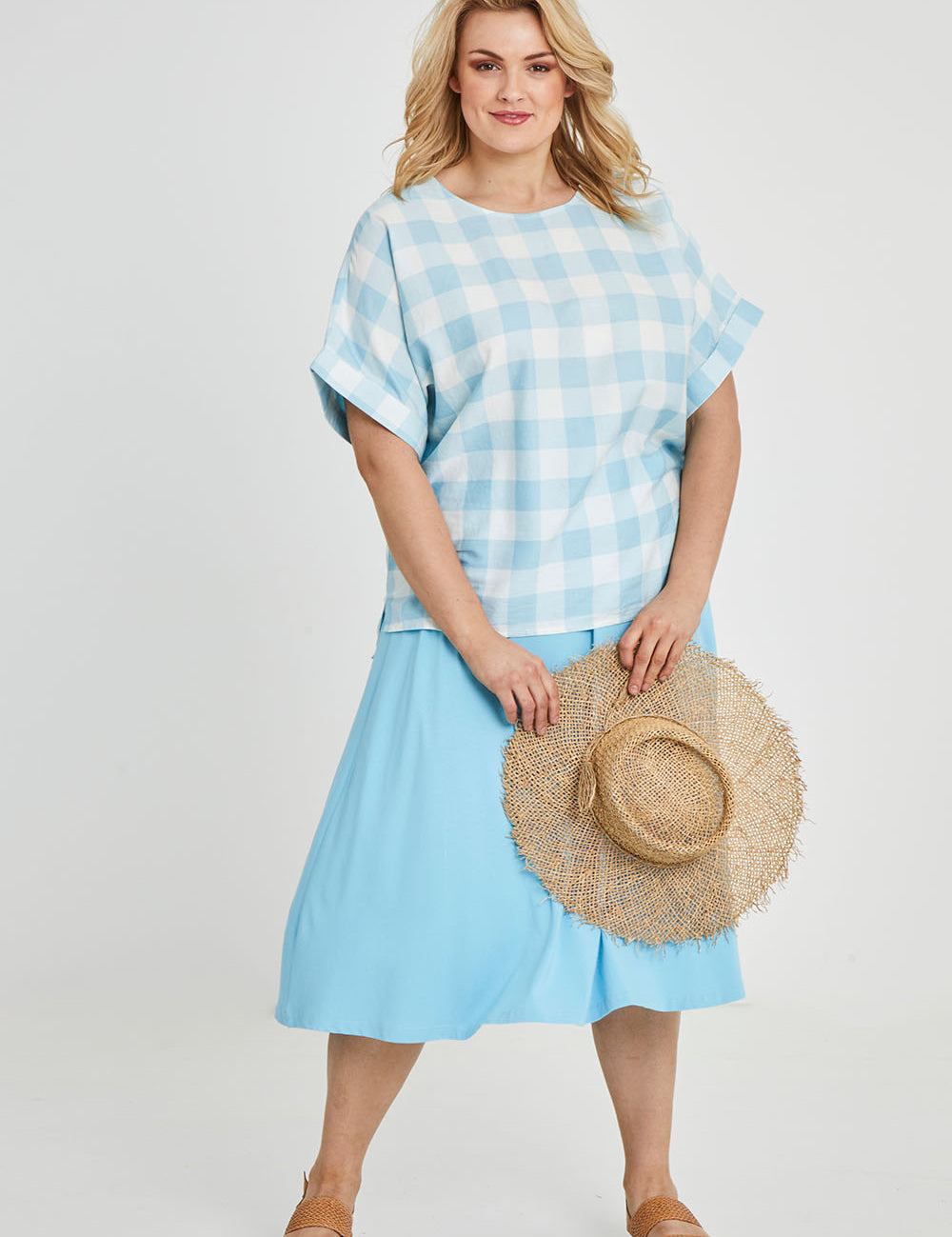 Model Keeara wearing size 16 of the Gingham Top in colour Gingham (Blue), from the front, showing the whole outfit