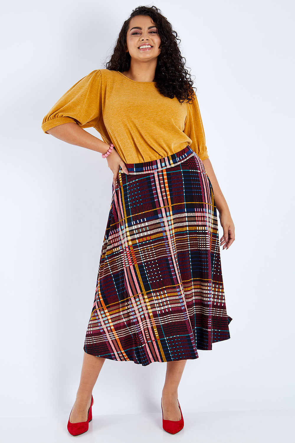 Model Sasha-Lee wearing size 16 of the Calf Length Full Skirt in colour Checked (Black), from the front, showing the whole outfit