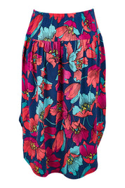 Product shot of the Elastic Waist Curved Hem Skirt in colour Lilly (Blue), from the back