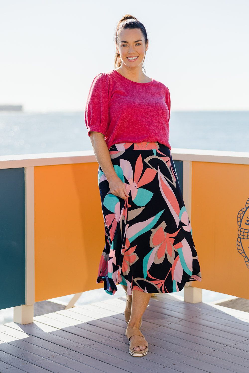 Model Laura wearing size 14 of the Printed Calf Length Full Skirt in colour Pastels (Blue), from the front, showing the whole outfit