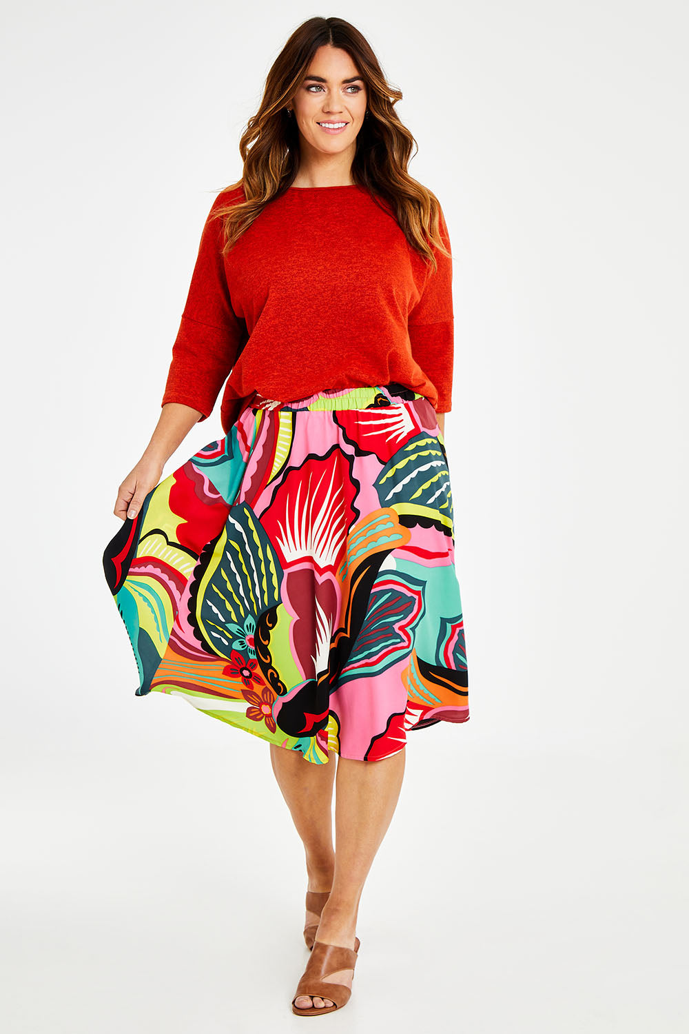 Model Laura wearing size 14 of the Printed Knee Length Skirt in colour Bloom (Pink), from the front, showing the whole outfit