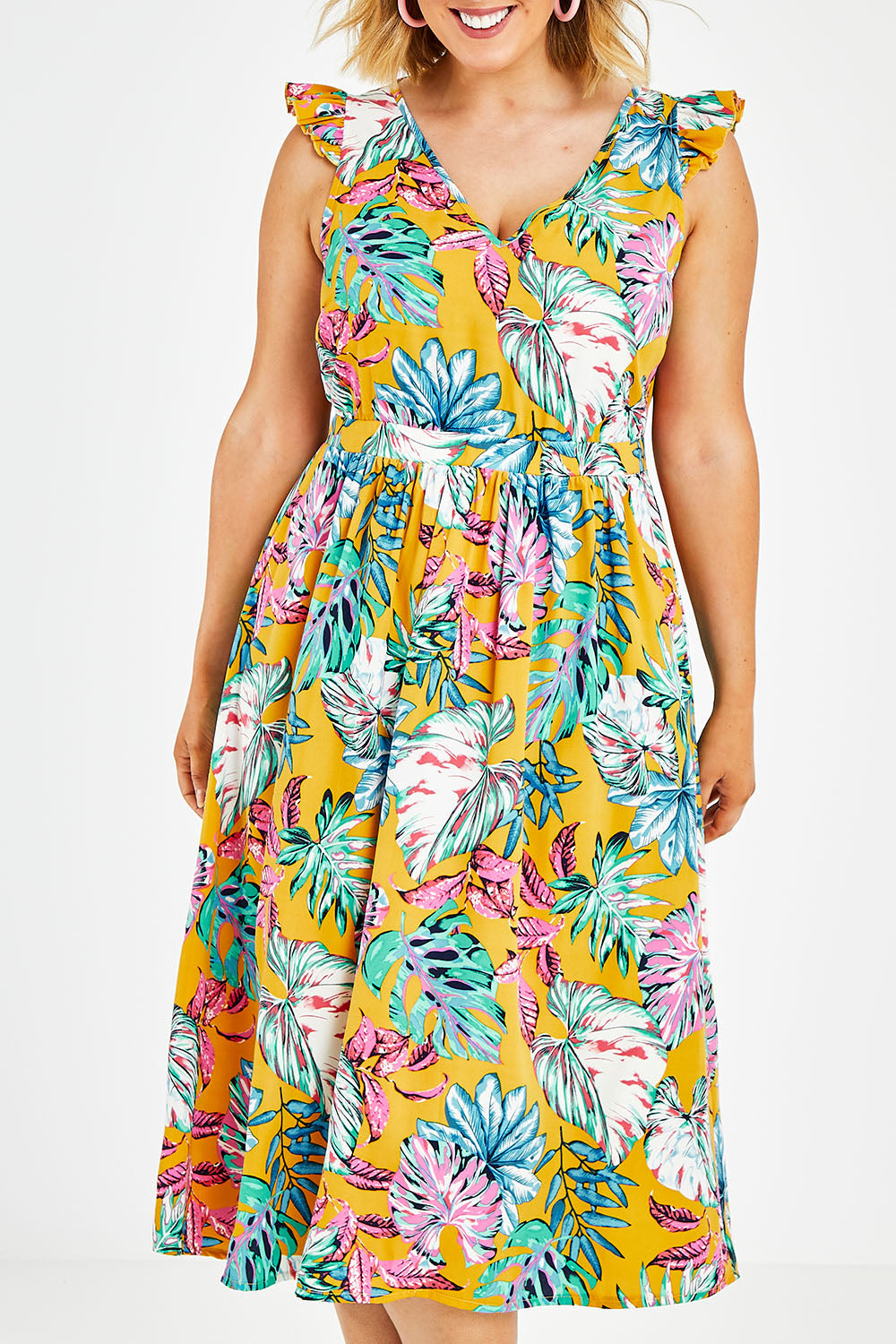 Model Jess wearing size 14 of the V Neck Gathered Sleeve Dress in colour Garden, from the front, cropped image