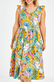 Model Jess wearing size 14 of the V Neck Gathered Sleeve Dress in colour Garden, from the front, cropped image