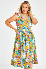 Model Jess wearing size 14 of the V Neck Gathered Sleeve Dress in colour Garden, from the front, cropped image
