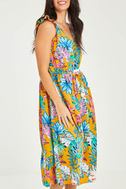 Model Stacey wearing size 10 of the V Neck Gathered Sleeve Dress in colour Garden, from the front, cropped image