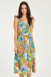 Model Stacey wearing size 10 of the V Neck Gathered Sleeve Dress in colour Garden, from the front, cropped image