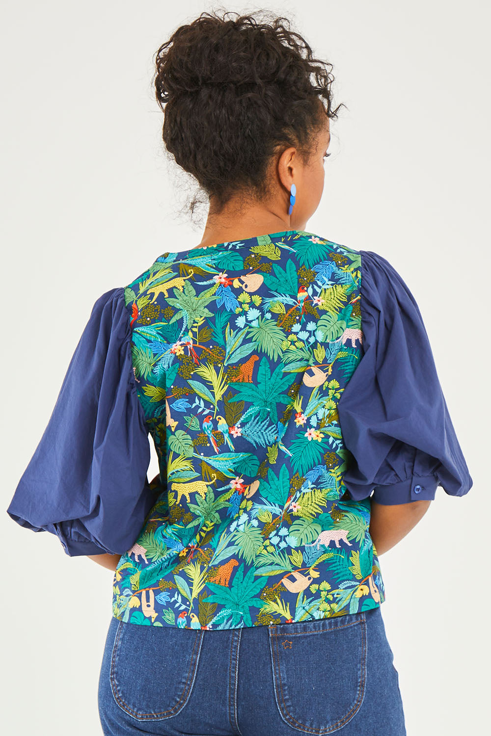 Model Noli wearing size 14 of the Printed Full Sleeve Top in colour Jungle (Blue), from the back