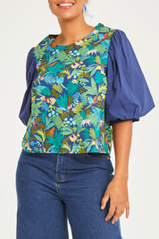 Model Noli wearing size 14 of the Printed Full Sleeve Top in colour Jungle (Blue), from the front, cropped image