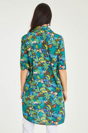 Model Stacey wearing size 10 of the Printed Tunic in colour Jungle (Blue), from the back