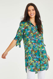 Model Stacey wearing size 10 of the Printed Tunic in colour Jungle (Blue), from the front, cropped image