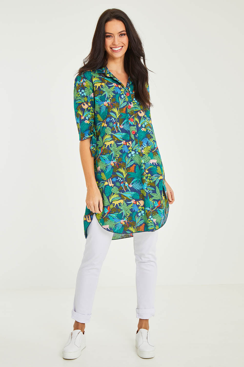 Model Stacey wearing size 10 of the Printed Tunic in colour Jungle (Blue), from the front, showing the whole outfit