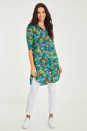 Model Stacey wearing size 10 of the Printed Tunic in colour Jungle (Blue), from the front, showing the whole outfit