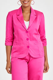 Model Noli wearing size 14 of the Buttoned Blazer in colour Hotpink (Pink), from the front, cropped image